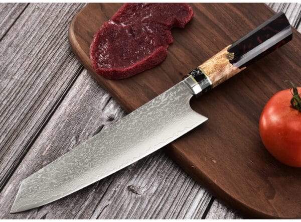 Black resin handle on a Kiritsuke chef’s knife, combining durability and modern style for professional use."