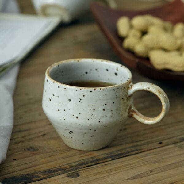 Elegant Shino-yaki coffee cup with a smooth glazed finish, perfect for adding a touch of artistry to your coffee routine.