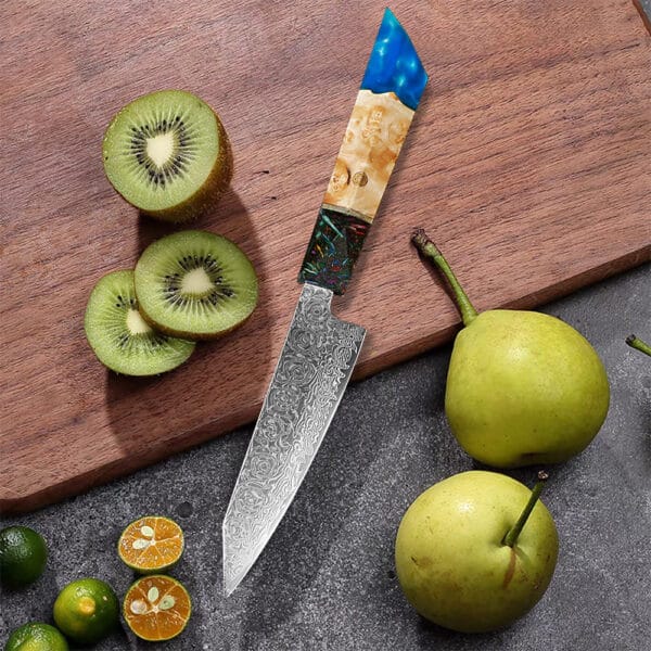 Side view of a Damascus steel utility knife, showcasing its 2.1mm spine thickness and ergonomic handle."