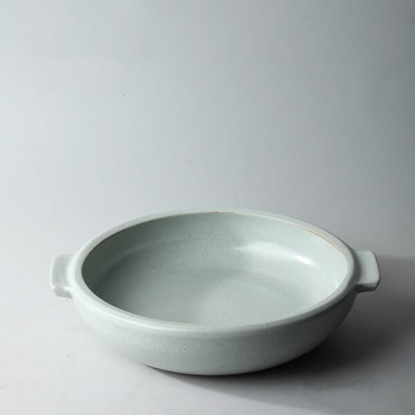 Set of stoneware serving plates in brown and white, perfect for versatile and stylish dining experiences."