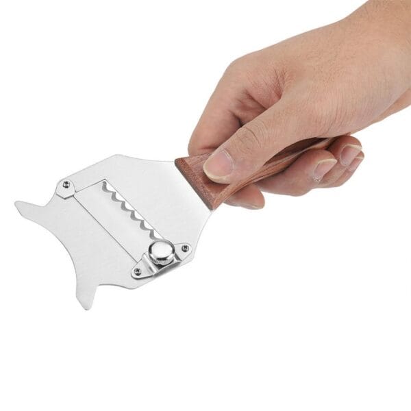 Top view of stainless steel truffle slicer featuring thumb wheel for blade adjustment