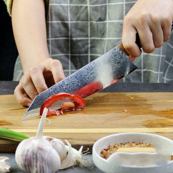 Side profile of Kiritsuke 20.5cm knife, displaying the 67-layer Damascus steel blade and its precise 15-degree edge.
