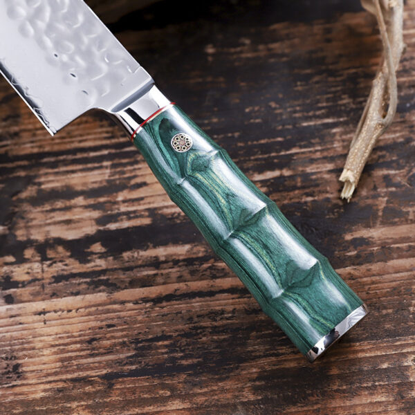 Detailed view of the double bevel edge on the 20cm Gyoto chef’s knife with wood handle.