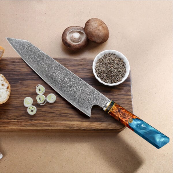 20cm Damascus Japanese chef knife with blue octagonal resin handle on cutting board
