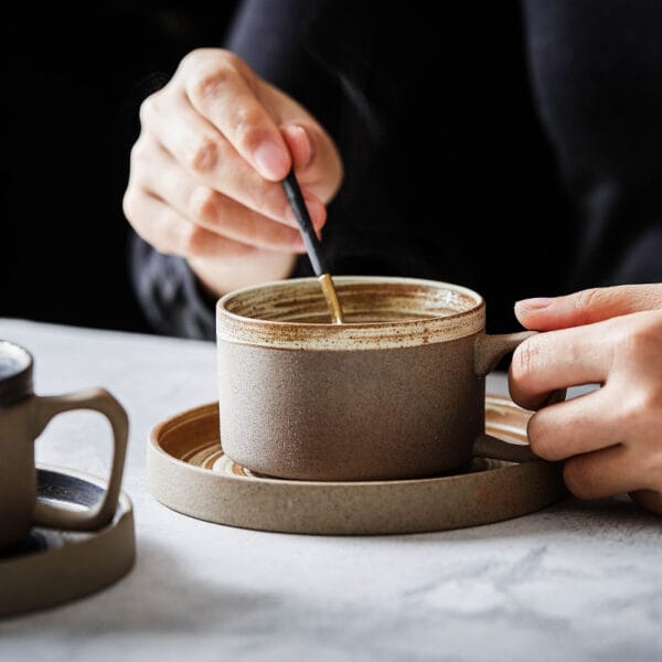 250ml ceramic coffee cup resting on a 14cm saucer, showcasing minimalist style