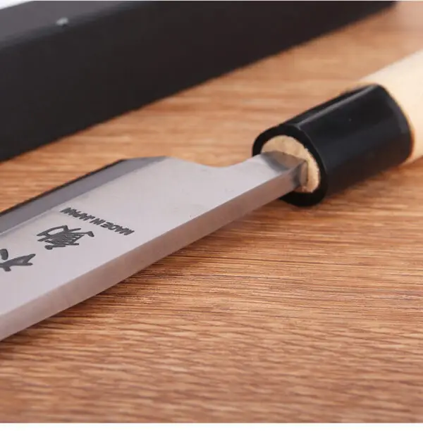 igh-carbon stainless steel Deba knife with a 21cm blade, offering durability and sharpness