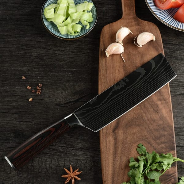 Close-up of the 17cm Nakiri chef’s knife showcasing its double bevel edge and rosewood handle.