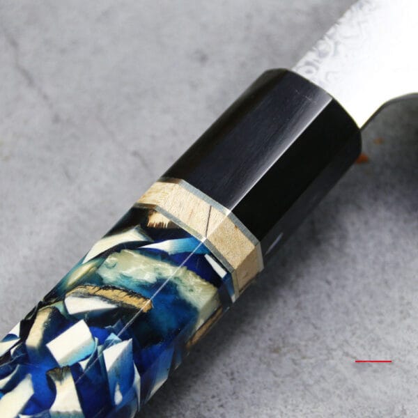 Mammoth Resin Cast handle of the Kiritsuke knife, featuring a smooth, high-end finish for a comfortable grip.