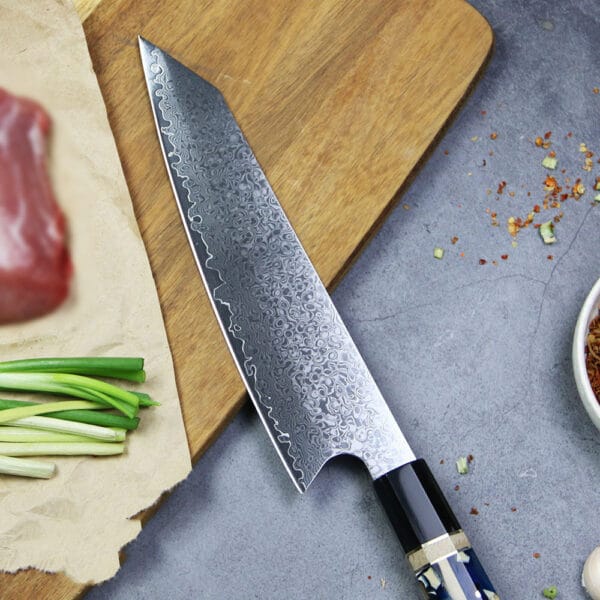 Kiritsuke 20.5cm chef’s knife with a polished Damascus blade reflecting light, showcasing its elegant craftsmanship.