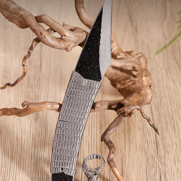 Utility knife with double bevel edge and ergonomic braided rope grip.