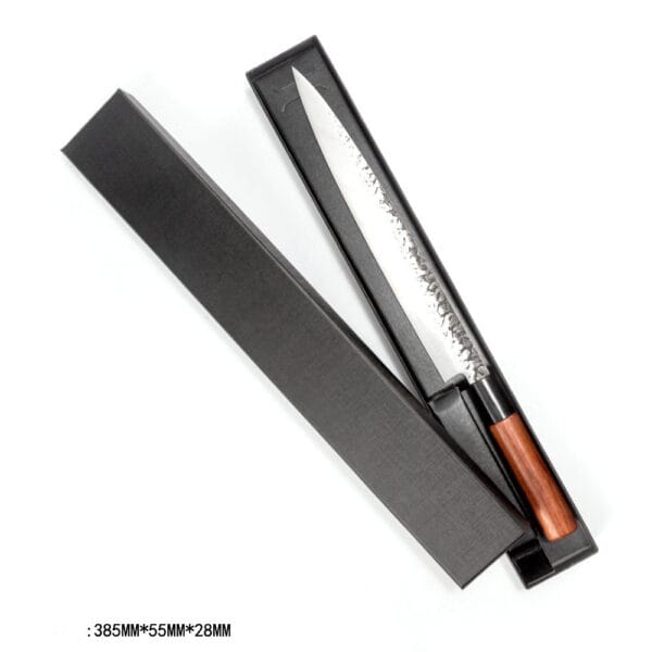 Sujihiki knife resting in a protective knife box, emphasizing its sleek profile and razor-sharp edge for slicing.