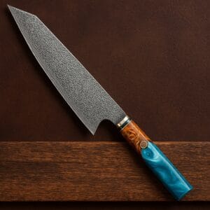 20cm Damascus Japanese Chef Knife with octagonal resin handle resting on wood and leather background