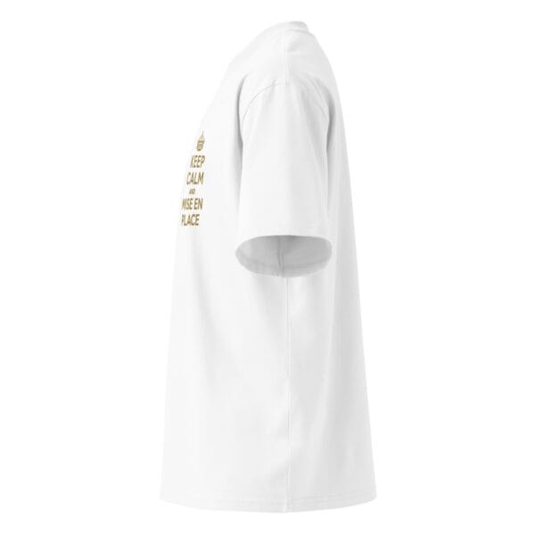 Side profile of white oversized unisex t-shirt with relaxed fit and dropped shoulder